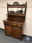 A late Victorian walnut mirror backed sideboard,