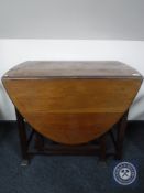 An Edwardian mahogany gate leg table