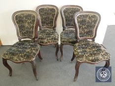 A set of four late Victorian mahogany dining chairs