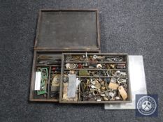 A wooden box containing radio parts, clips, bulbs, valves etc.