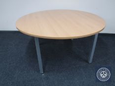 A circular pine topped office table and two square office tables