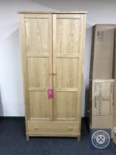 A Bentley Designed oak double door wardrobe fitted a drawer