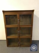 A glazed mahogany stacking bookcase