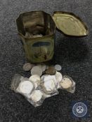 A tin containing a quantity of decimal and pre-decimal British and foreign coins