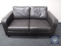 A black leather two seater settee