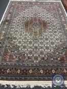 A Tabriz design carpet on cream ground,
