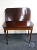 A George III mahogany turnover top tea table