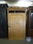 An antique pine hall wardrobe