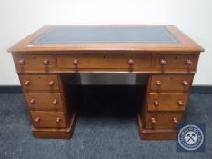 A Victorian mahogany child's writing desk fitted nine drawers