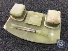 An onyx desk stand with letter opener and ashtray