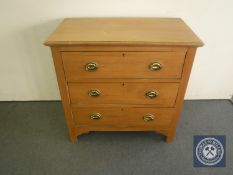 An Edwardian pine three drawer chest