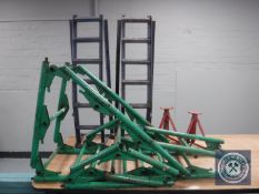 A pair of car axle stands and car ramps and a metal folding ladder