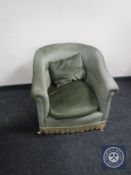A twentieth century armchair upholstered in green dralon