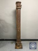 A 19th century cast iron horse post with hitch