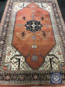 A fringed carpet with geometric design