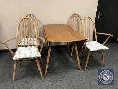 An Ercol elm drop leaf dining table, width 125 cm,