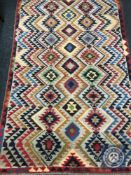 An Afghan wool rug,
