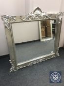 A Victorian style silvered overmantel mirror 123 cm x 119 cm