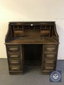 An Edwardian oak roll top desk,