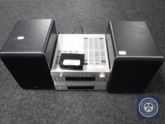 A Denon two-piece separates system with iPod dock and speakers,