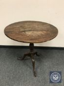 A George III oak tripod table,