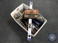 A box containing a large quantity of assorted power tools, drill bits, ring spanners,