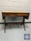 A 19th century walnut sofa table