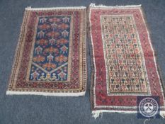 Two antique Afghan rugs