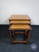 A nest of three teak G Plan tables
