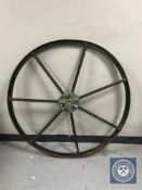 An antique cast iron wagon wheel,