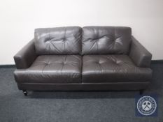 A black leather two seater settee