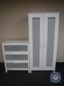 A white double door wardrobe and matching three drawer chest