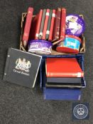 A box and crate of thirteen stamp albums and folders together with four tubs of loose stamps