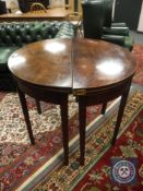 Two George III inlaid mahogany D-shaped tables.