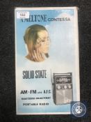 A Meltone Contessa solid state portable radio in original box.