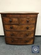 A Victorian mahogany bow fronted chest of five drawers,
