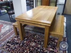 A contemporary Orlando furniture pull out dining table together with two benches