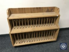 A pine wall mounted plate rack