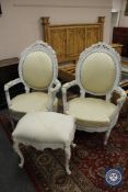 A pair of continental style carved armchairs and a matching footstool.