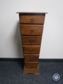 A narrow Eastern mahogany six drawer chest