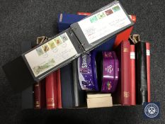 A box of stamp albums and stamps