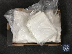 A box of two vintage bed spreads and linen pillow cases