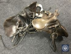 Two leather saddles