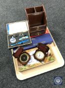 A tray containing ship's style compass and clock, three Native American style knives,