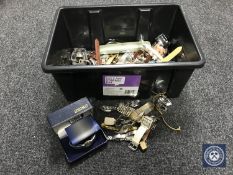 A plastic box containing a large quantity of assorted lady's and gent's watches