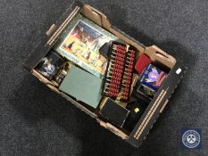 A box of containing jigsaw, playing cards, abacus, miniature doll,