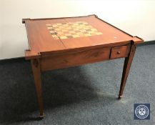 An Eastern mahogany games table with chessboard top
