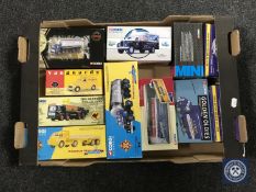 A box containing boxed Corgi and Vanguards die cast vehicles