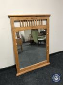 A contemporary overmantel mirror