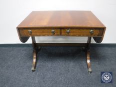 A Regency style sofa table fitted two drawers